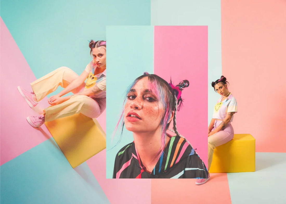 Fashion portrait of a young woman with pink hair highlights, colorful outfit, and pop art background