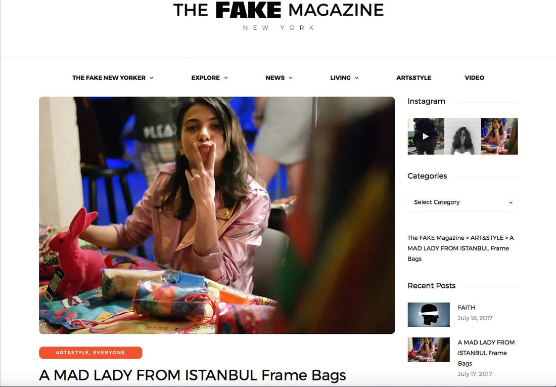 Woman in pink jacket making peace sign at a colorful art and style event with vibrant bags and a pink bunny