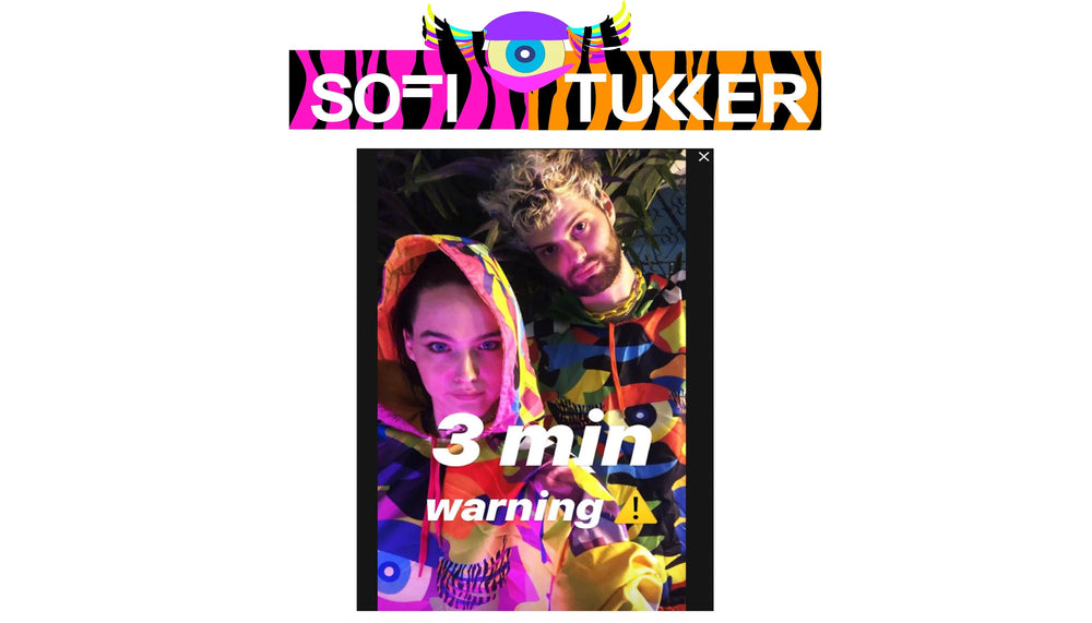 Sofi Tukker duo in colorful hoodies with bold patterns, text 3 min warning, vibrant lighting