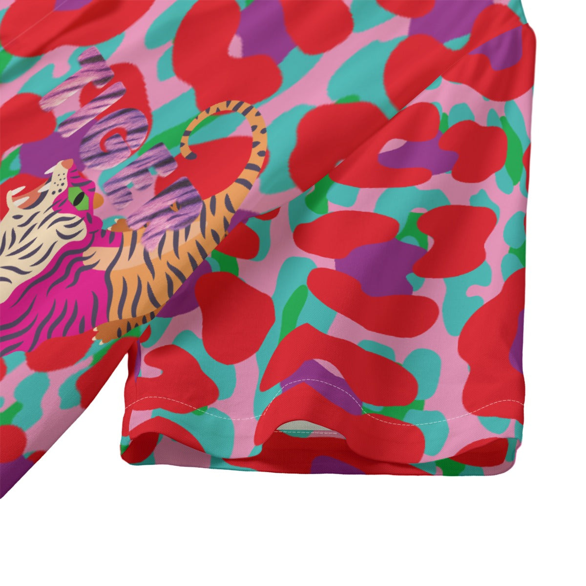Colorful swimsuit with abstract design and tiger illustration on a white background