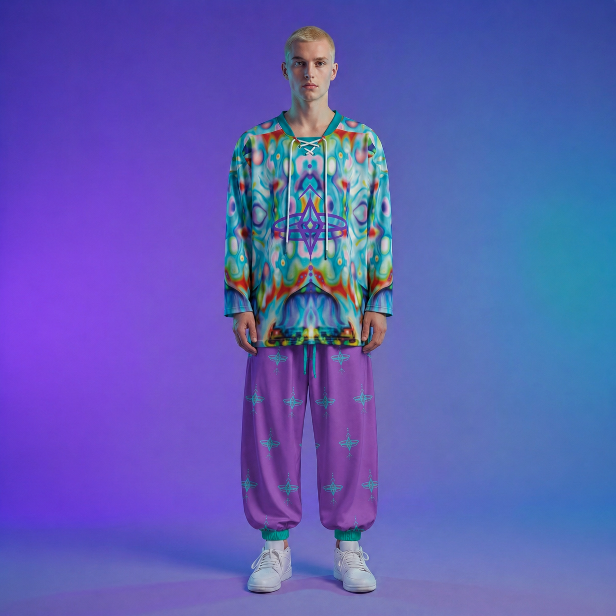 Person wearing a colorful patterned outfit with purple pants on a gradient background