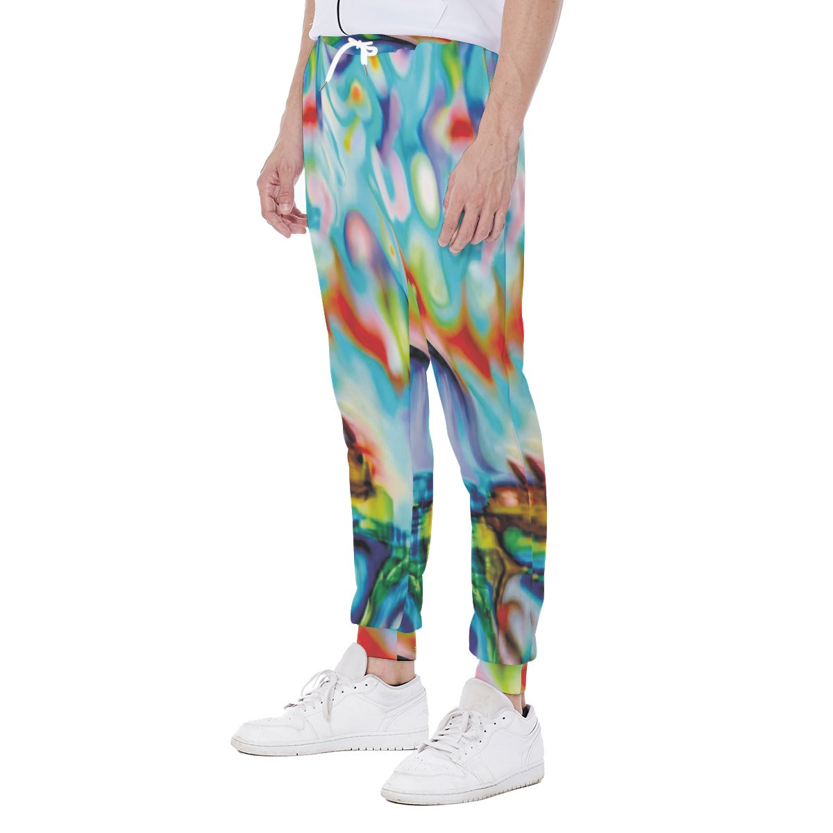 Colorful abstract-patterned pants worn by a person on a white background