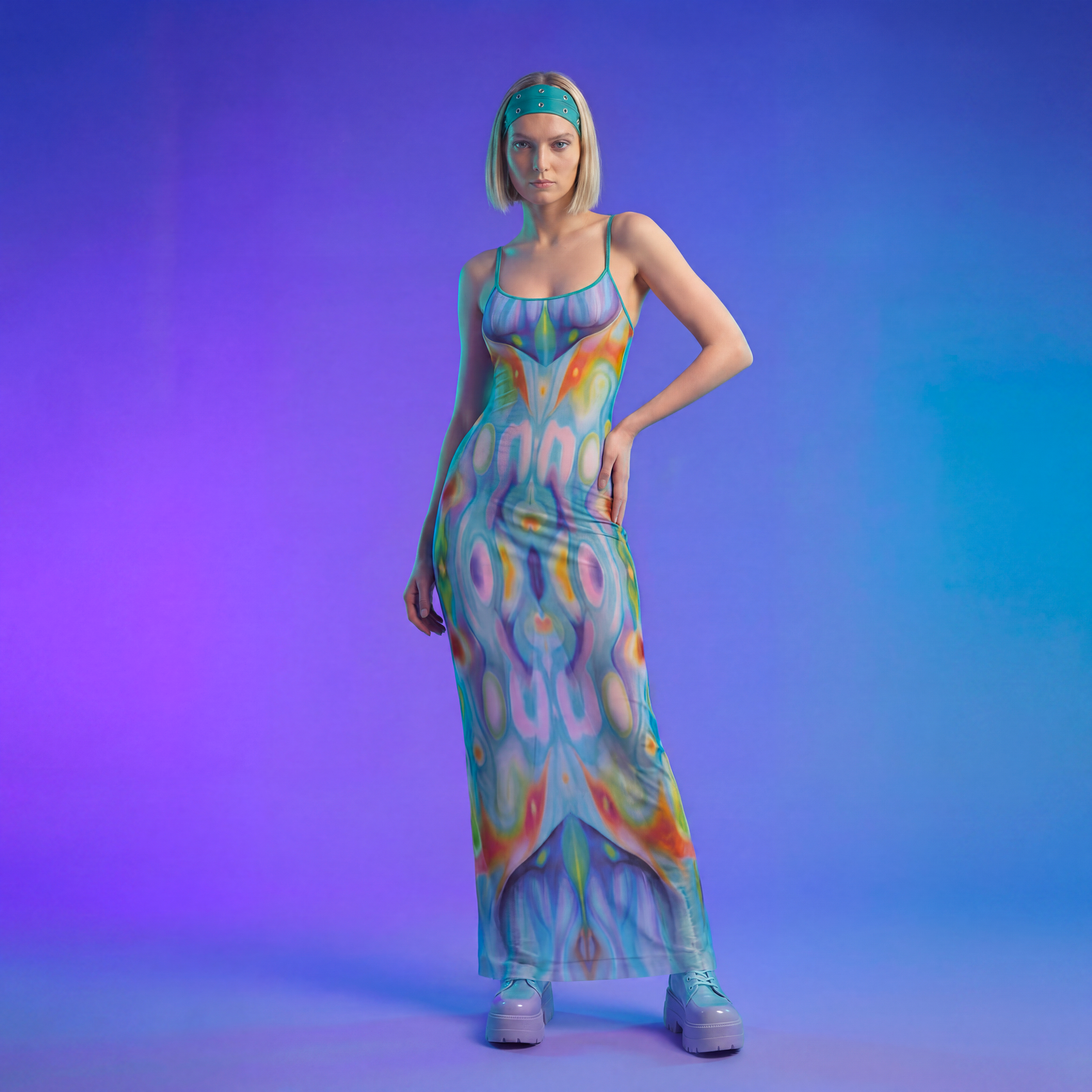 Woman wearing a colorful dress with a gradient background