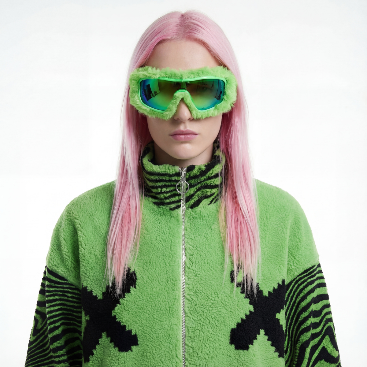 Person wearing a green outfit with black patterns and green goggles on a white background