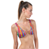 Woman wearing a colorful striped bikini top on a white background