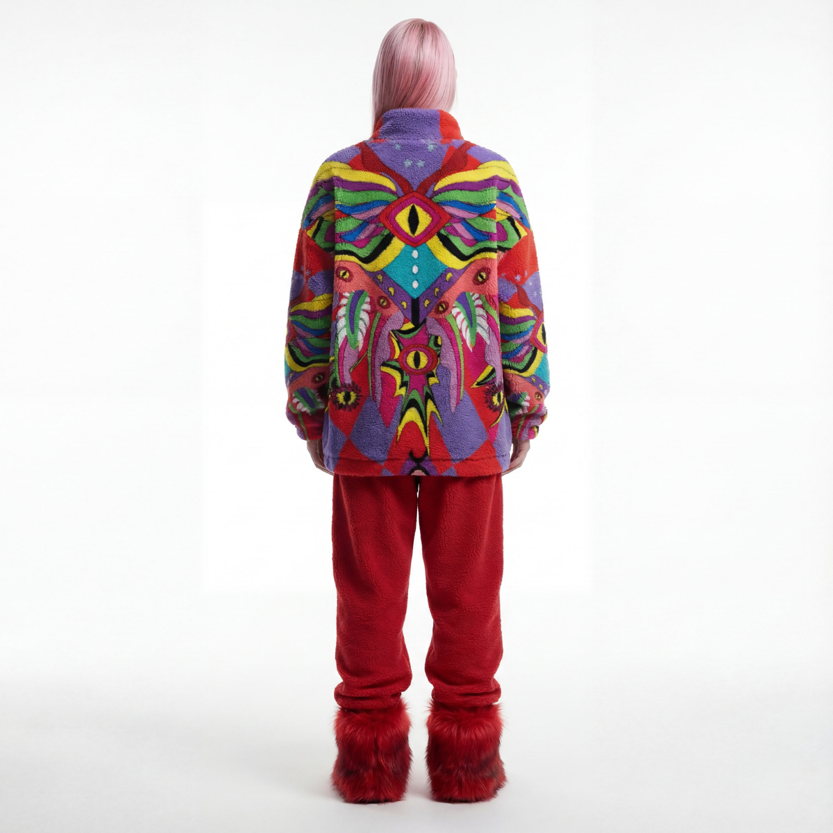 Person wearing a colorful jacket with abstract patterns on a white background