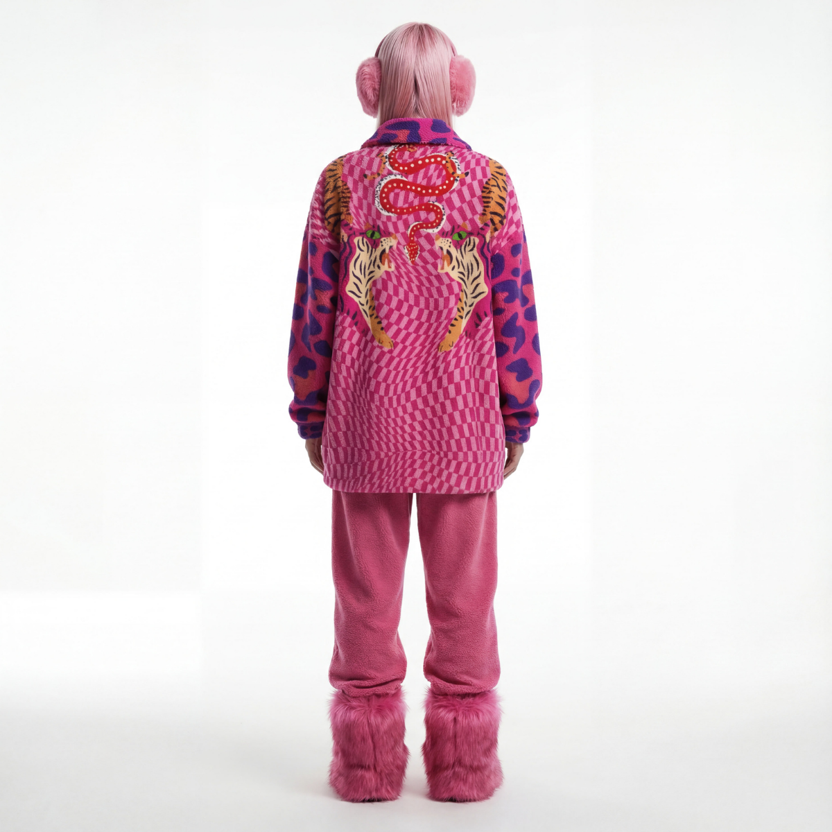 Person wearing a pink outfit with animal print patterns on a white background