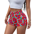 Person wearing colorful Tiger Paw Pattern  shorts on a white background