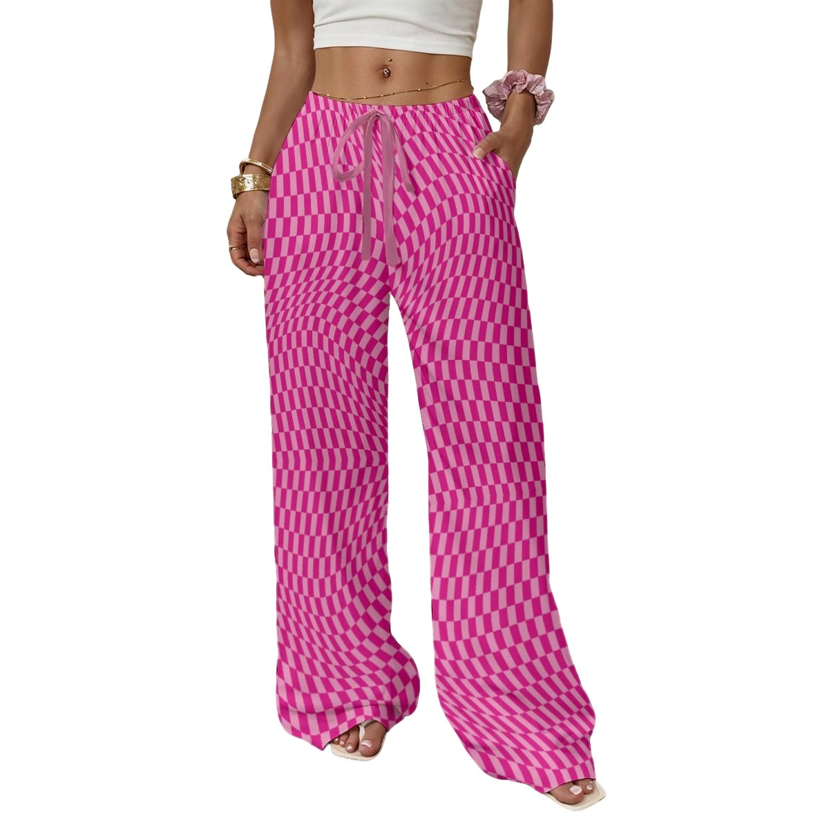 Person wearing pink checkered pants on a white background